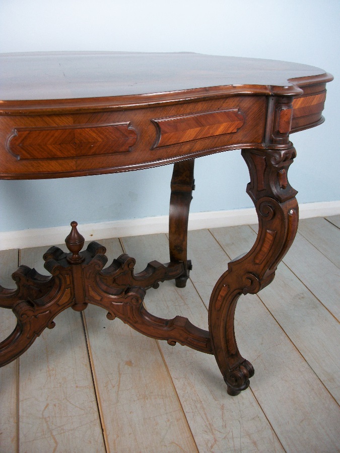 Antique Italian Occasional Table with profusely carved and shaped legs 